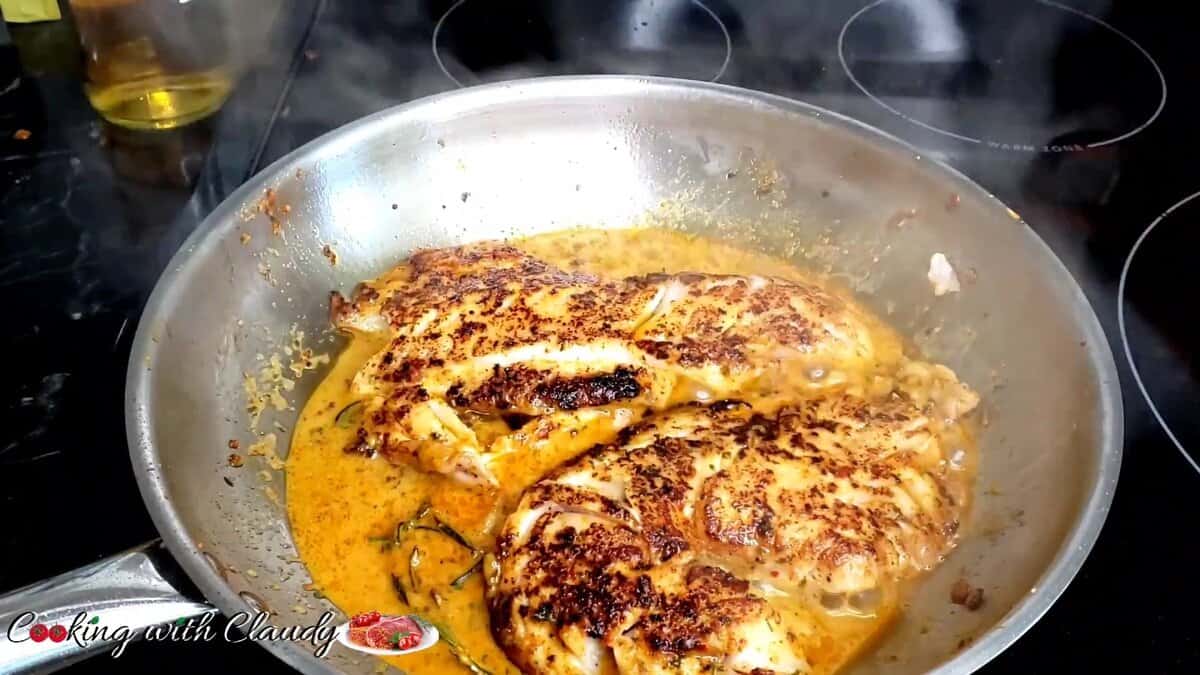 perfectly seared fish with golden skin and flaky texture in sauce