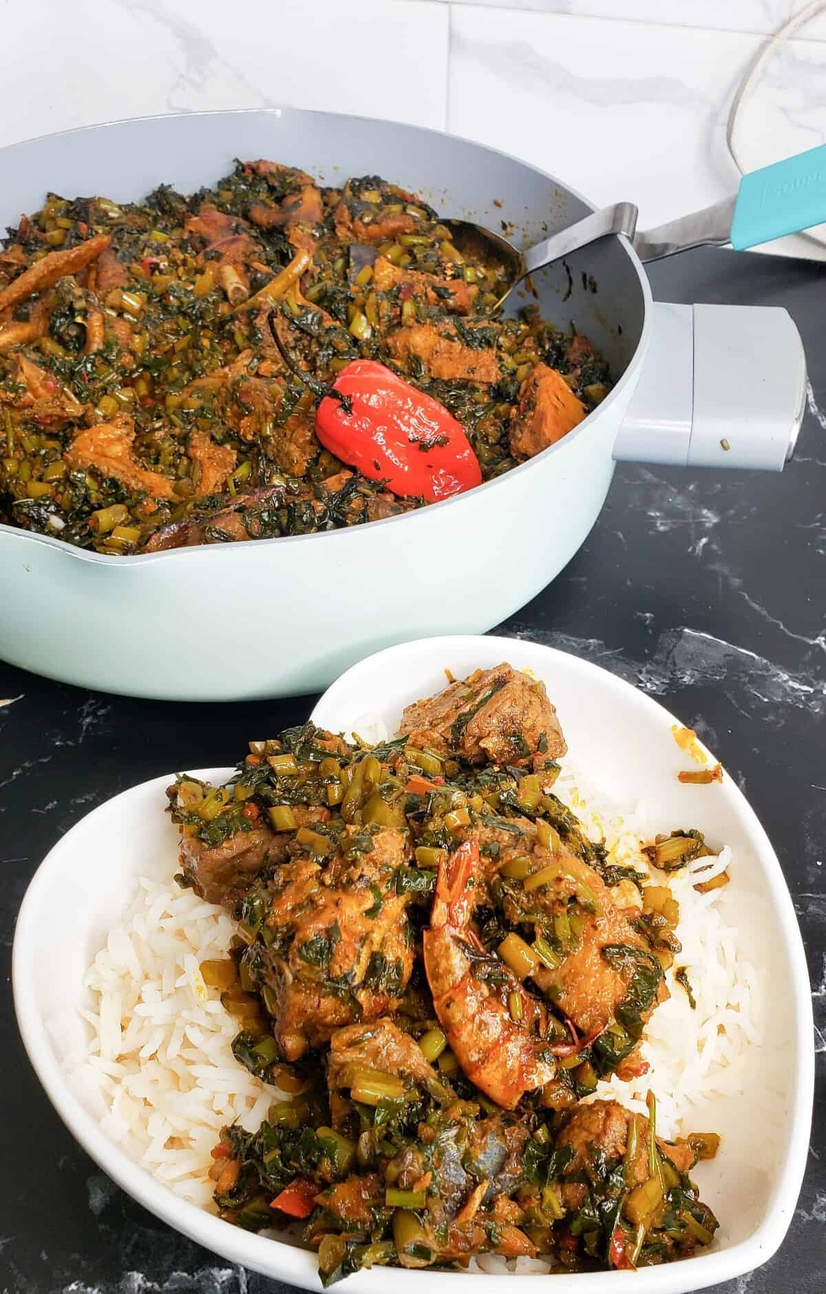 Sweet potato leaves stew on top of rice