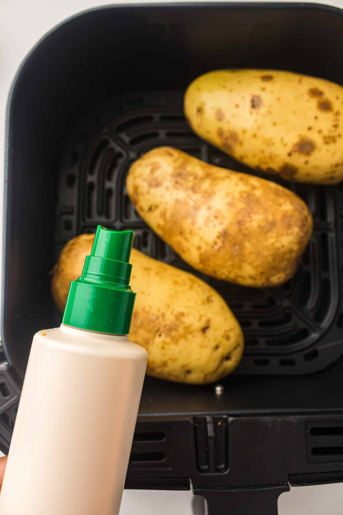 air fryer potatoes in an air fryer basket