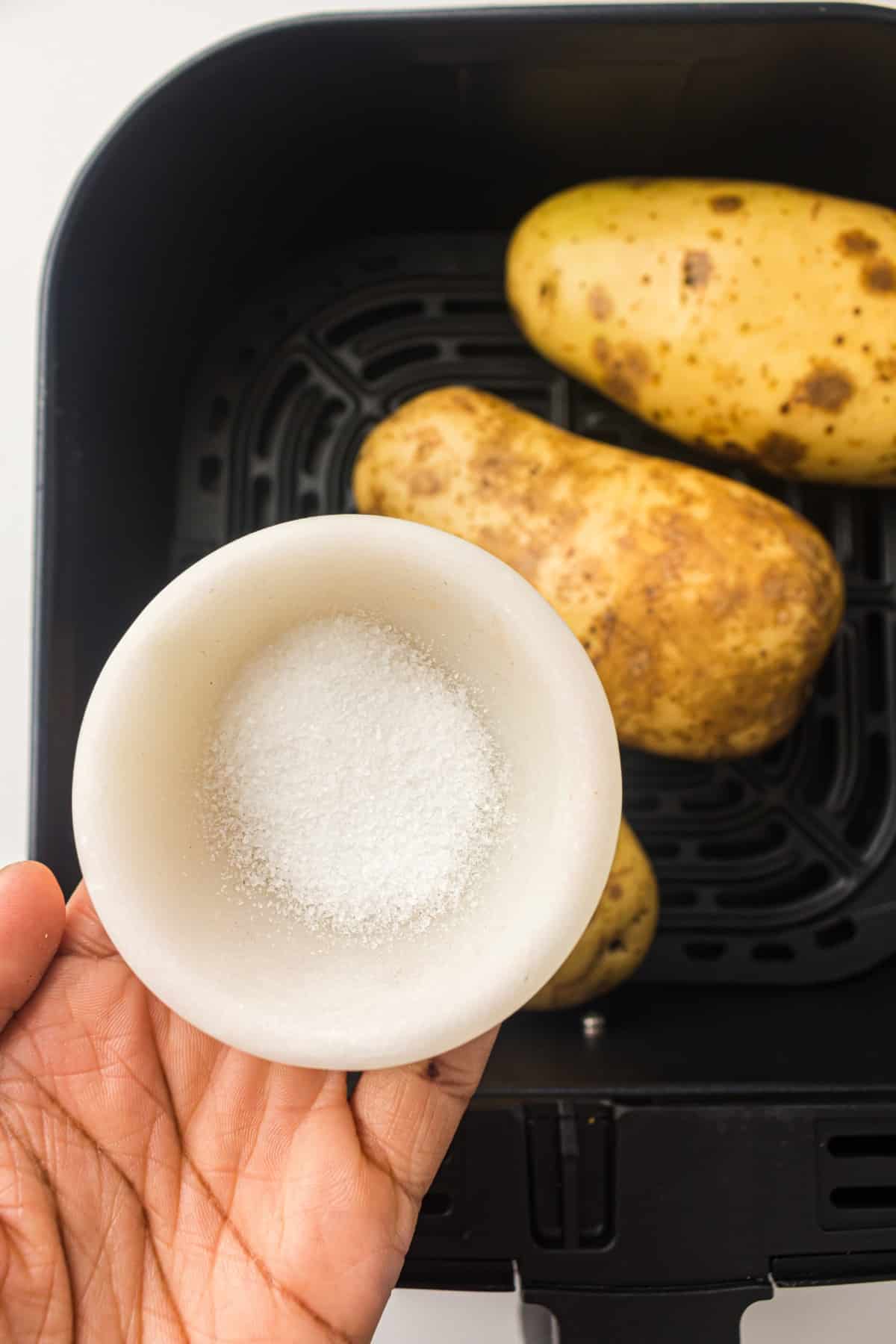 air fryer potatoes in an air fryer basket