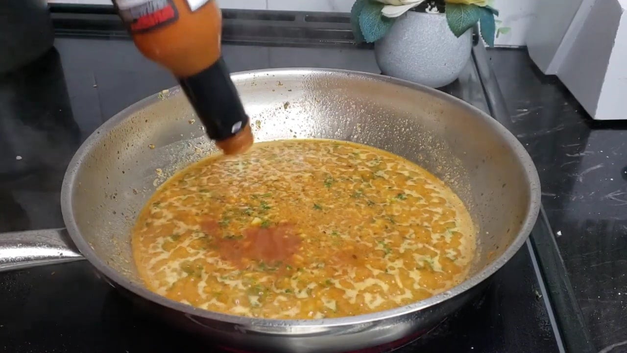cajun butter sauce simmering in a pan