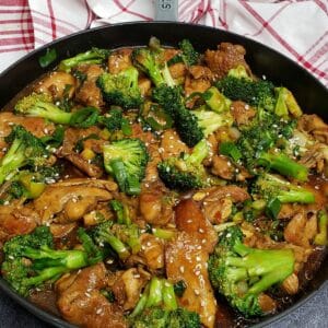 chicken and broccoli stir fry in a skillet