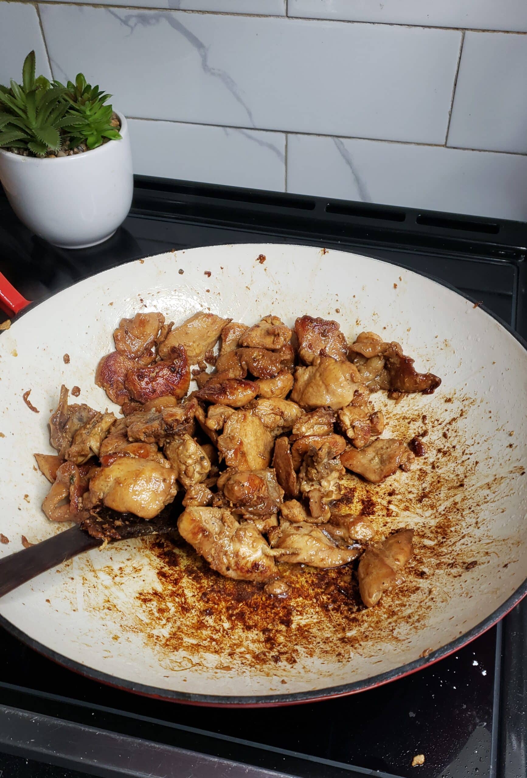 cooked chicken for stir fry in a wok