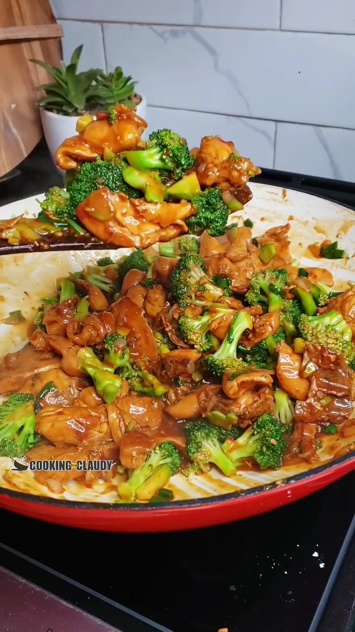 chicken and broccoli stir fry in a wok