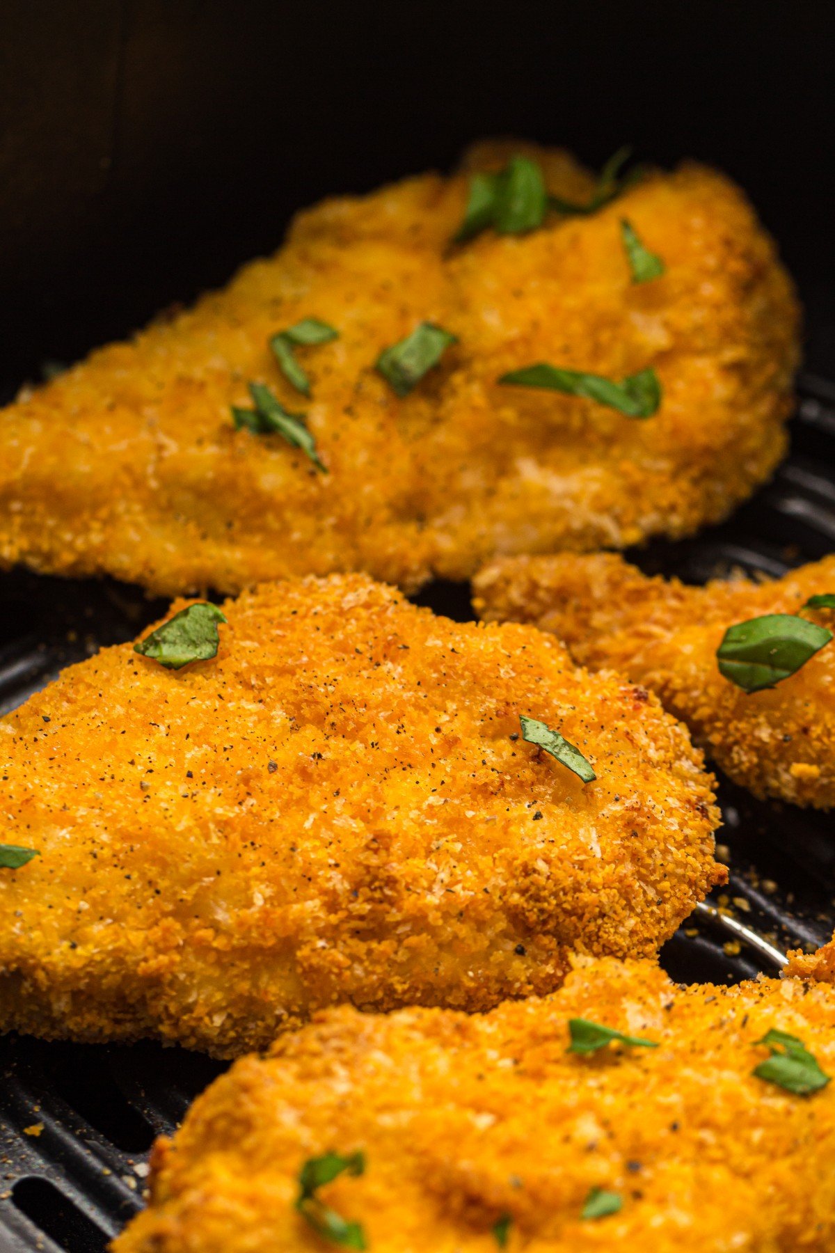 Easy and crispy air fryer chicken cutlet on an air fryer pan